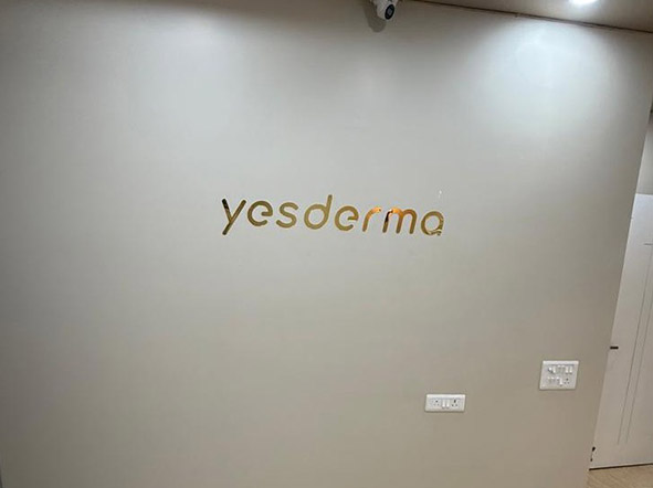 Dermatologist examining a patient's skin